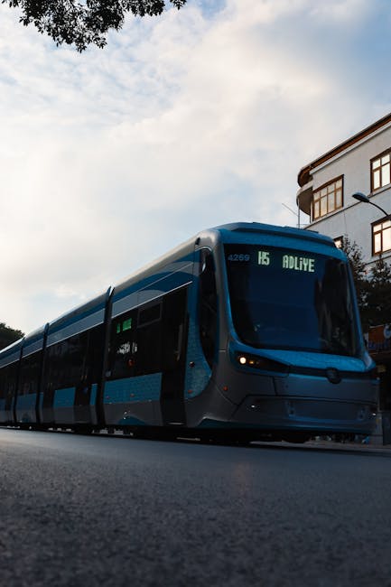 Modern blue tram with number 15 sign